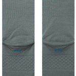 Stance Icon Crew Sock 2024 - A pair of gray crew socks with a repeating pattern of small, stylized icons in various colors.