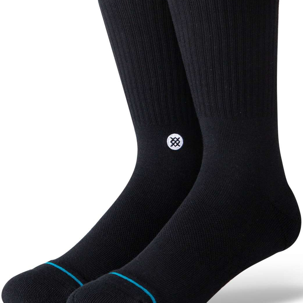 Stance Icon Crew Sock 2024 - Black crew socks with a small white logo on the ankle area featuring a black design.