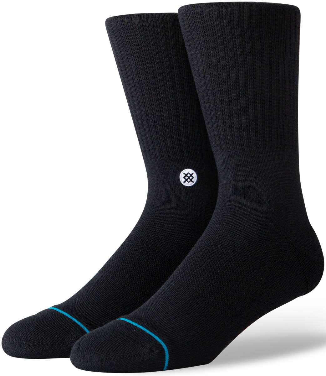 Stance Icon Crew Sock 2024 - Black crew socks with a small white logo on the ankle area featuring a black design.