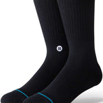 Stance Icon Crew Sock 2024 - Black crew socks with a small white logo on the ankle area featuring a black design.