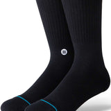 Stance Icon Crew Sock 2024 - Black crew socks with a small white logo on the ankle area featuring a black design.
