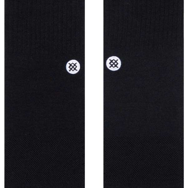 Stance Icon Crew Sock 2024 - Black crew socks with a white logo on the top of each foot.
