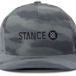 Stance - A black hat with a white logo on the front, featuring a stylized "S" and "I" intertwined in a circular pattern.