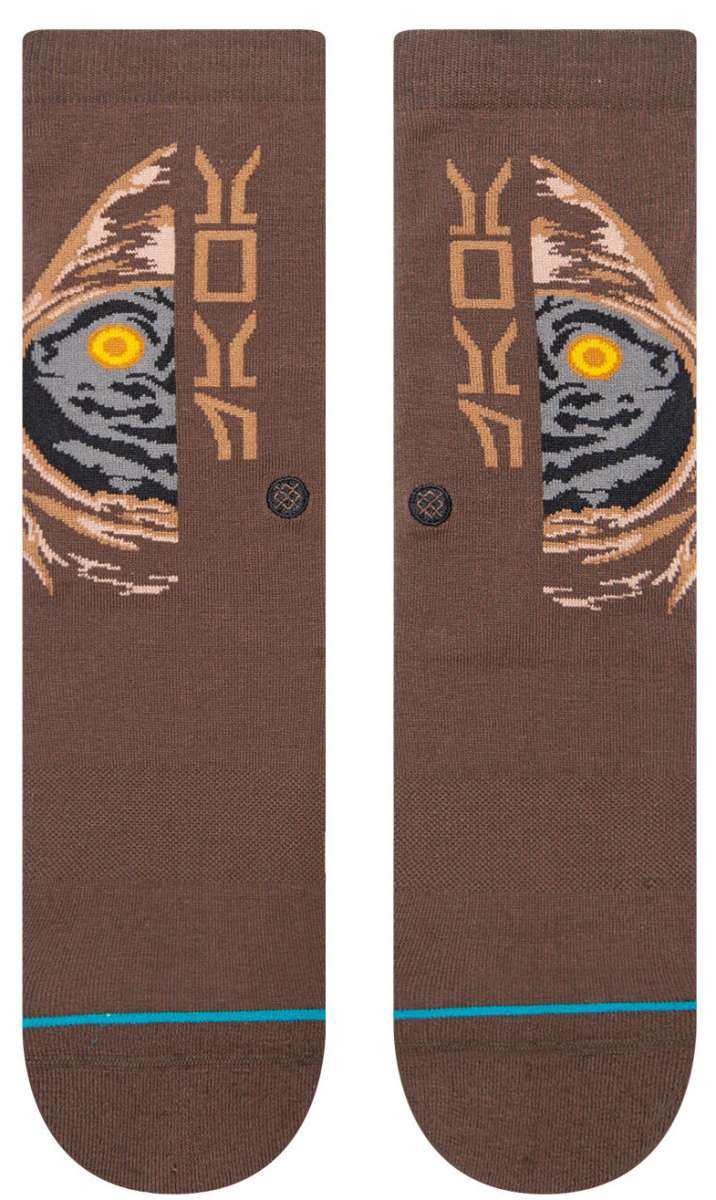 Stance Kids Jawa Crew Sock 2023 - A pair of brown crew socks with a stylized image of a character from Star Wars, possibly a young Jawa, in shades of gray and tan.