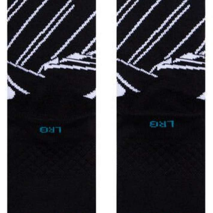 Stance Juniors Batman Crew Socks 2023 - Black crew socks with white bat logo on top of a black background.