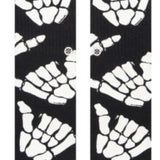 Stance Kids' Zombie Hang Crew Socks 2023 - Black socks with white zombie hands and feet in various poses.
