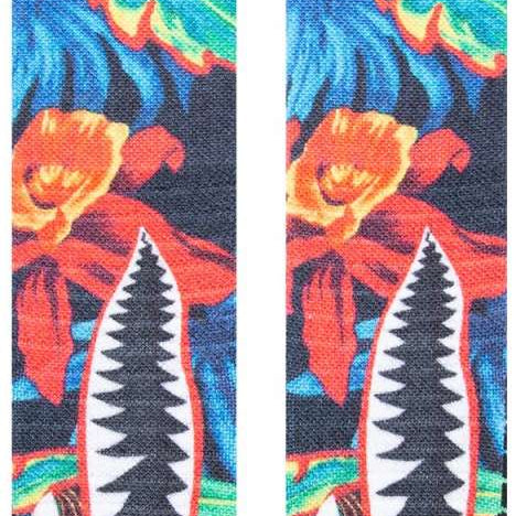 Stance Kids Bomin Snow Crew Sock 2024 - A pair of snow socks with a colorful design featuring orange, blue, and green hues.