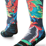 Stance Kids Bomin Snow Crew Sock 2024 - A pair of crew socks with a colorful, abstract design featuring red, blue, green, and yellow shapes on a black background.