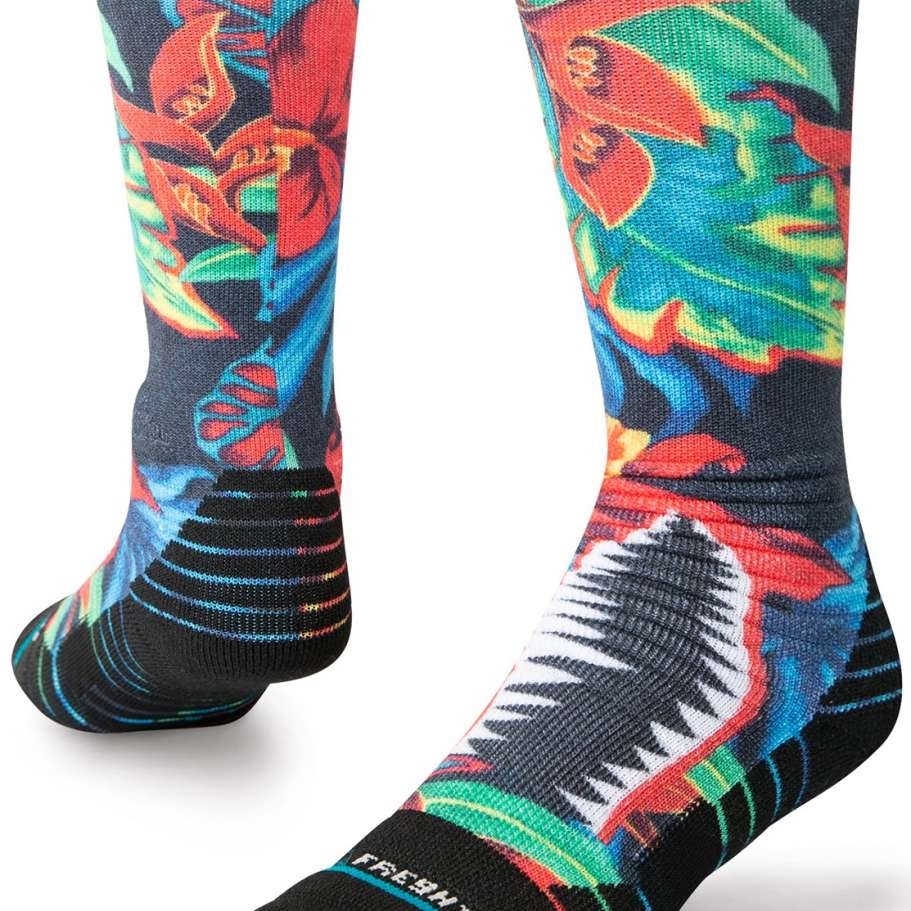 Stance Kids Bomin Snow Crew Sock 2024 - A pair of crew socks with a colorful, abstract design featuring red, blue, green, and yellow shapes on a black background.
