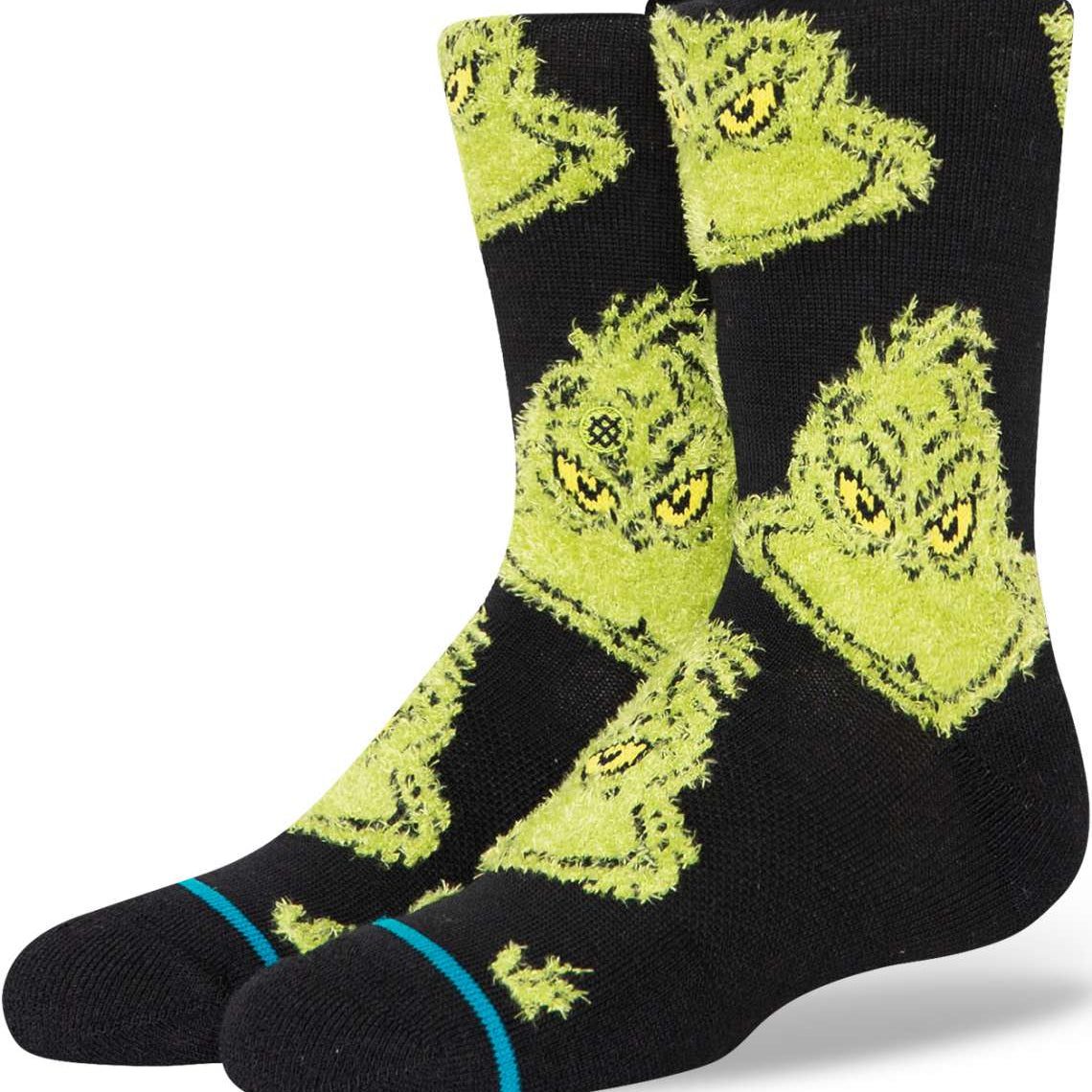 Stance Kids Mean One Crew Sock 2024 - A pair of black crew socks with a repeating pattern of mean-mugging green cartoon characters.