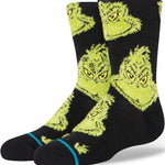 Stance Kids Mean One Crew Sock 2024 - A pair of black crew socks with a repeating pattern of mean-mugging green cartoon characters.