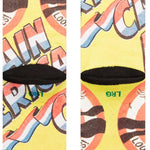 Stance Kids No Cavities Crew Sock 2024 - A pair of crew socks with a cartoon tooth and "No Cavities" written on them in blue, pink, and white.