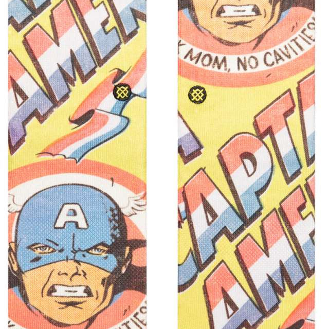 Stance Kids No Cavities Crew Sock 2024 - A pair of crew socks with a blue and red design featuring a tooth and the words "No Cavities".