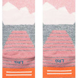 Stance - Lonely peaks design in shades of pink, white, and gray on a light gray background.