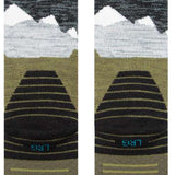 Stance - Lonely peaks design with snow-capped mountains in shades of white and gray on a green background.