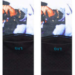 Stance Makaveli Crew Sock 2023 - A pair of white crew socks with a black graphic featuring a man's face and hat on the top portion.