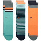 Stance Neptune Crew Sock 3 Pack 2024 - A pack of three crew socks in a light blue color with dark blue stripes and an orange logo on the ankle.