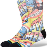 Stance No Cavities Crew Sock 2024 - A pair of crew socks with a blue and red design featuring Captain America's face, and the words "No Cavities" written in white letters on a pink background.