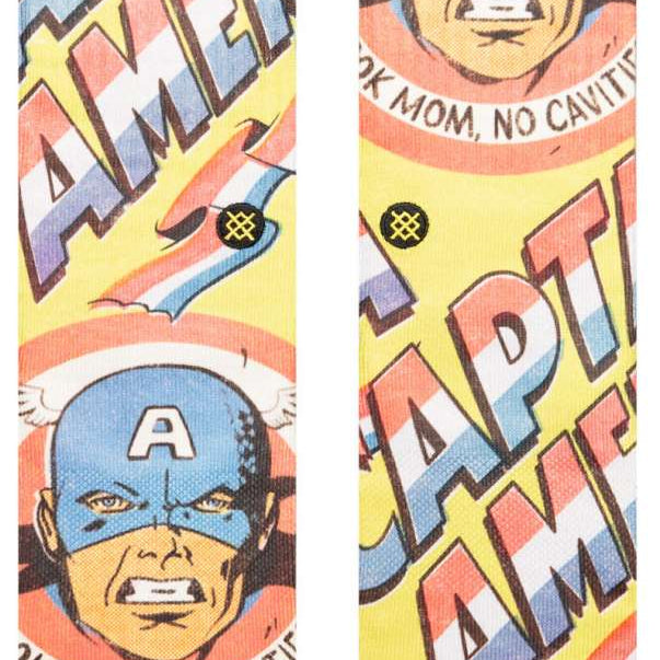 Stance No Cavities Crew Sock 2024 - A pair of crew socks with a blue and white tooth design on a light gray background.