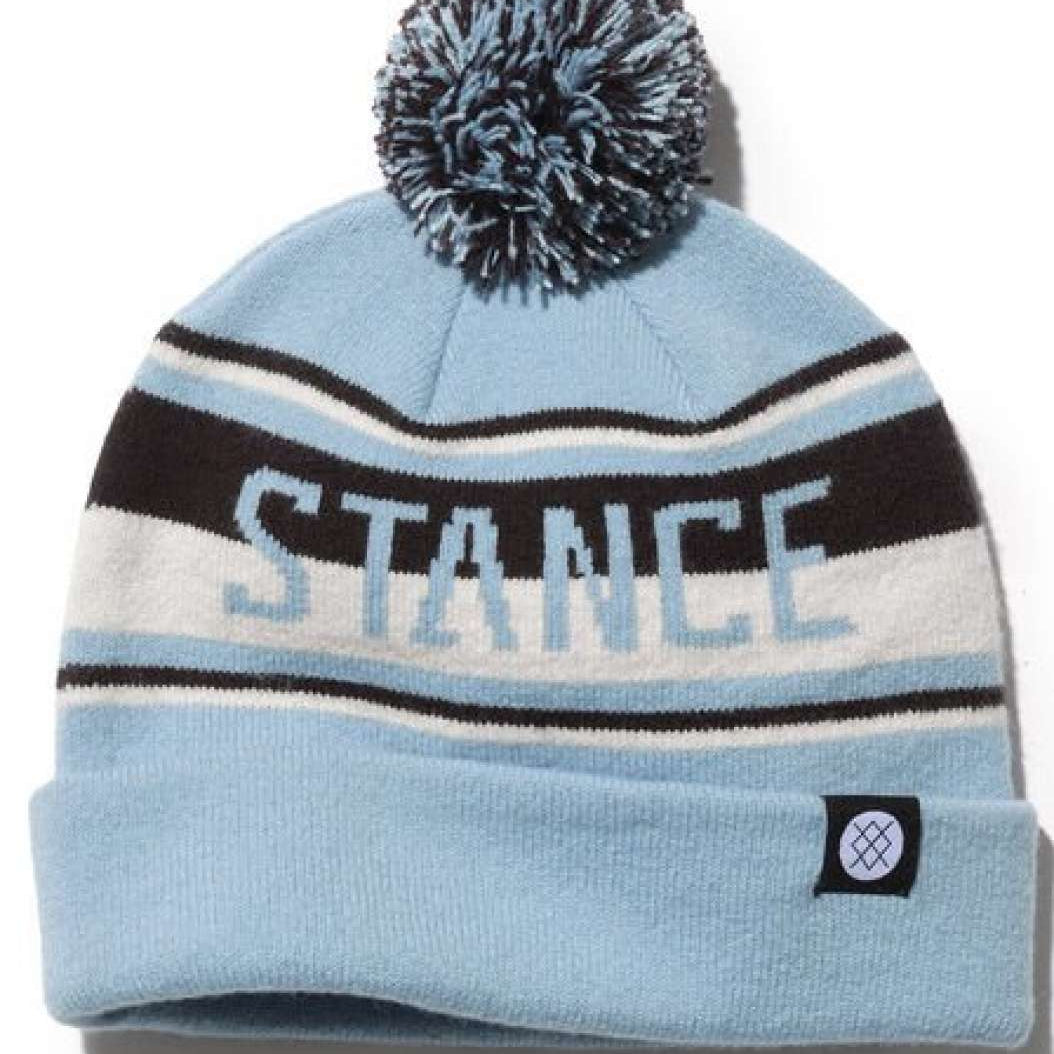 Stance OG Pom Beanie 2023 - A light blue beanie with a large pom-pom on top and black stripes around it.