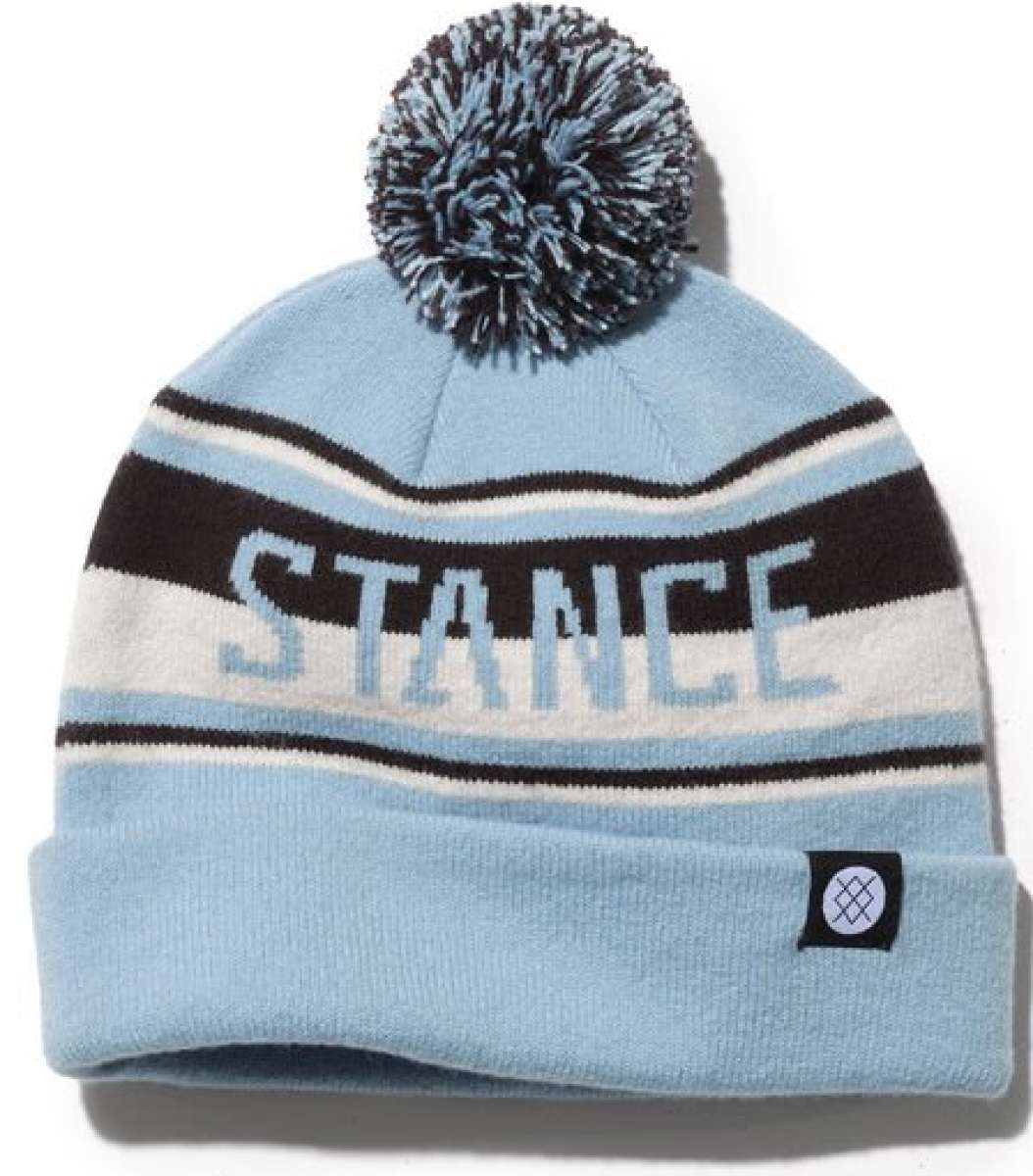 Stance OG Pom Beanie 2023 - A light blue beanie with a large pom-pom on top and black stripes around it.