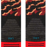 Stance Pelter Snow Sock 2024 - Black snow socks with a repeating pattern of red and white snowflakes.