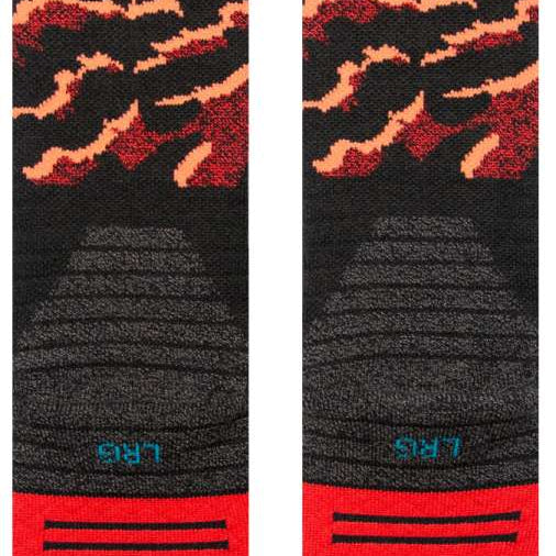 Stance Pelter Snow Sock 2024 - Black snow socks with a repeating pattern of red and white snowflakes.