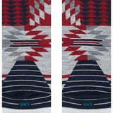 Stance Reaux Snowboard Socks 2023 - A pair of snowboard socks with a red, white and black geometric pattern on a gray background.