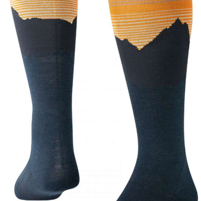 Stance Rising Snow SB Sock 2024 - A pair of snowboard socks with a rising sun design in shades of orange and yellow at the top, fading to gray towards the toes.