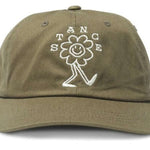 Stance Standard Adjustable Cap 2023 - A khaki green baseball cap with a white embroidered logo on the front featuring a stick figure in a t-shirt and shorts, smiling and holding up one hand.