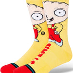 Stance Stewie Crew Sock 2024 - A pair of crew socks featuring an image of Stewie Griffin from Family Guy in a red outfit on a yellow background.