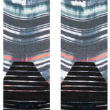 Stance Traditions Snow Crew Sock 2024 - A pair of crew-length socks with a repeating pattern of snowflakes and trees in shades of blue, white, and gray.