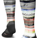 Stance Traditions Snow Sock 2023 - A pair of snow socks with a multicolored pattern featuring shades of blue, red, and green stripes on a white background.