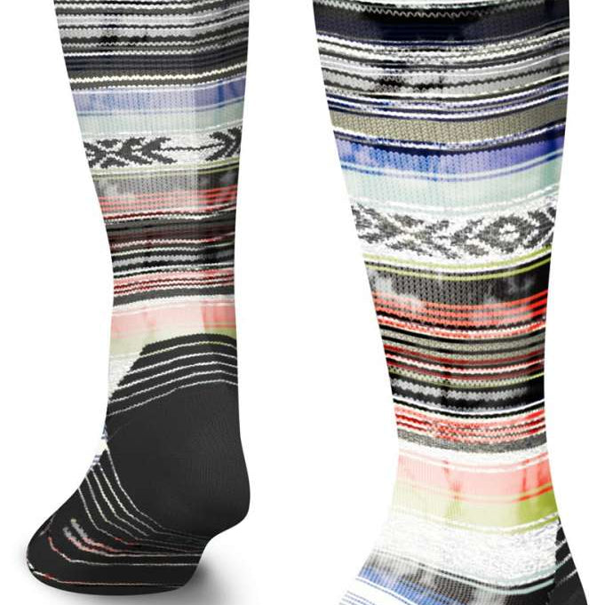Stance Traditions Snow Sock 2023 - A pair of snow socks with a multicolored pattern featuring shades of blue, red, and green stripes on a white background.
