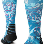 Stance Trooms Snow Sock 2024 - A pair of knee-high snow socks with a light blue background and white, pink, and purple abstract floral pattern.