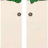 Stance Turtles Crew Sock 2024 - A pair of white crew socks with green "TURTLES" logo on top and red "TMUTANT NINJA" logo above it.