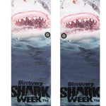 Stance Kids' Shark Week Crew Socks 2023 - A pair of crew socks with a shark design on them, featuring a large shark's head and teeth in shades of gray and white.
