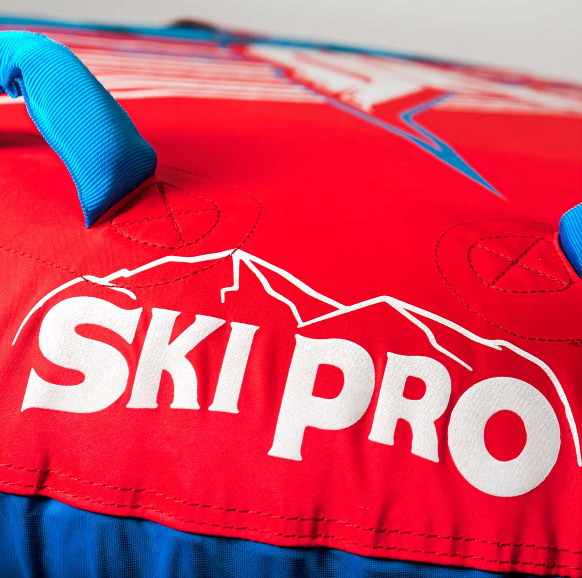 HO Sports x Ski Pro Sunset 2 Person Tube 2021 - A red tube with a blue and white sunset design, featuring two handles on top.