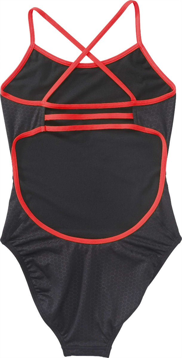 TYR Ladies' Hexa Trinityfit Swimsuit - A black swimsuit with a hexagonal pattern and red trim, featuring thin straps that cross over at the back.