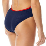 TYR Ladies' Hexa Trinityfit Swimsuit - A navy blue swimsuit with red trim and straps, featuring a cut-out detail on the back.