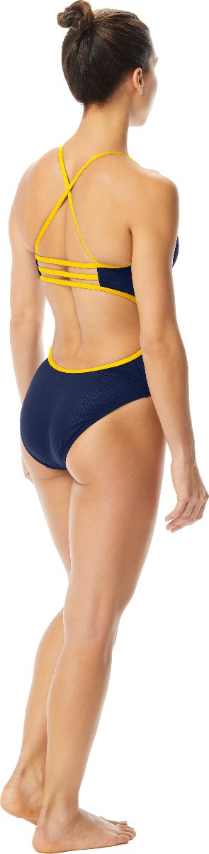 TYR Ladies' Hexa Trinityfit Swimsuit - A navy blue swimsuit with yellow trim and straps.