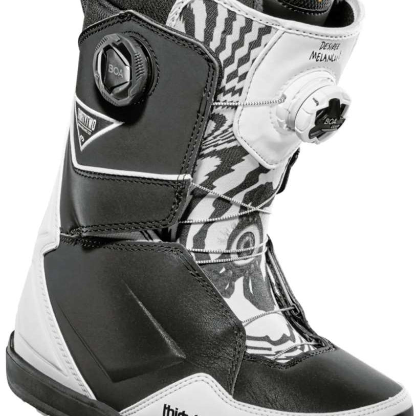 ThirtyTwo Women's Lashed Double BOA x Melancon Snowboard Boot 2024 - Black snowboard boots with a white and grey patterned design on the tongue and ankle strap.