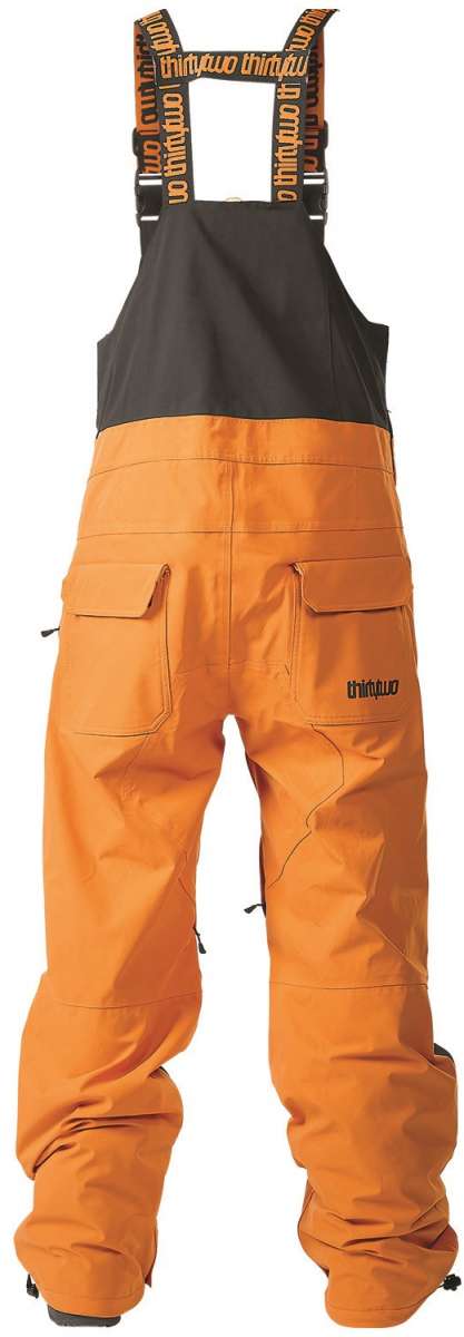 ThirtyTwo Basement Shell Bib Pant 2024 - Black bib pant with white logo on left thigh and black drawstring at waist.