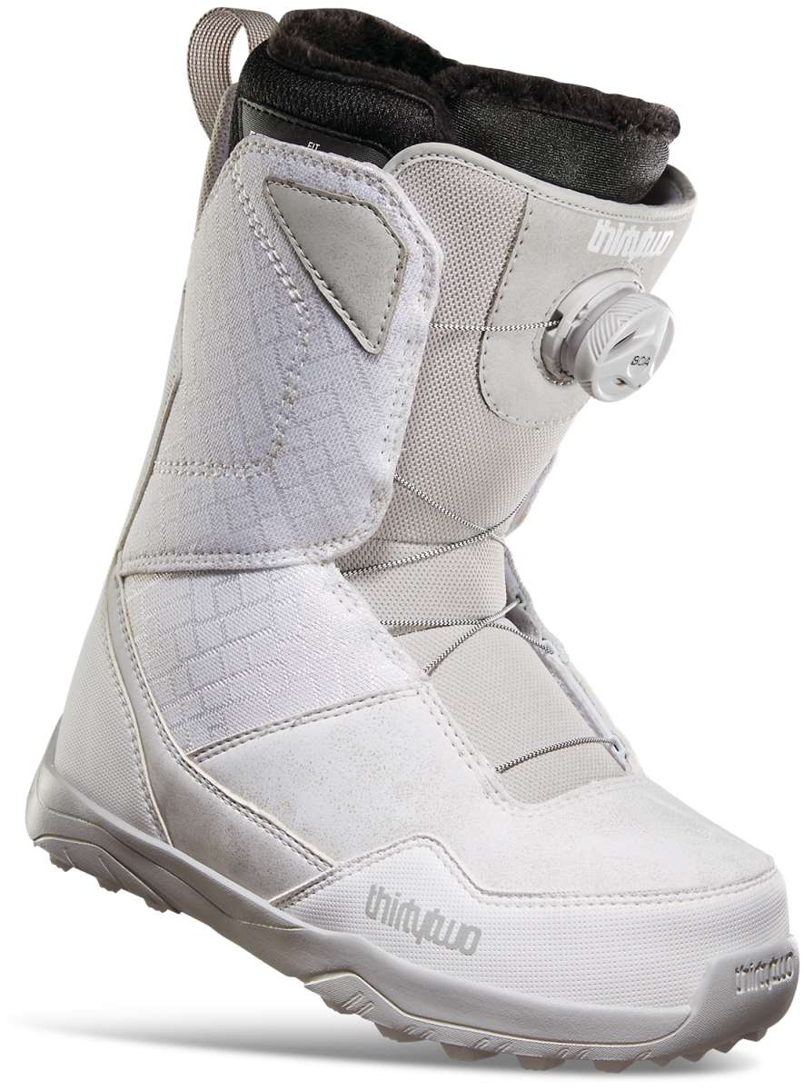 ThirtyTwo Women's Shifty BOA Snowboard Boot 2023 - A white snowboard boot with a black BOA dial on the side and a gray strap that goes across the top of the foot.