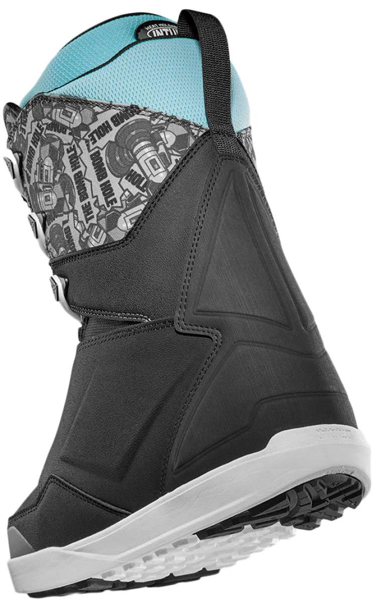 ThirtyTwo Lashed x Bomb Hole Snowboard Boots 2024 - Black boots with a gray patterned strap and white soles.