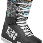 ThirtyTwo Lashed x Bomb Hole Snowboard Boots 2024 - A pair of snowboard boots with a black and white color scheme, featuring a repeating pattern of "Bomb Hole" logos in gray on the upper portion.