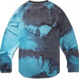 ThirtyTwo Ridelite Long Sleeve Shirt 2024 - A long-sleeved shirt with a crew neck and raglan sleeves, featuring a tie-dye pattern in shades of blue and gray.