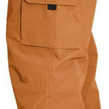 Turbine FDGB Shell Pant 2022 - A pair of tan snow pants with a red logo on the upper left pocket.