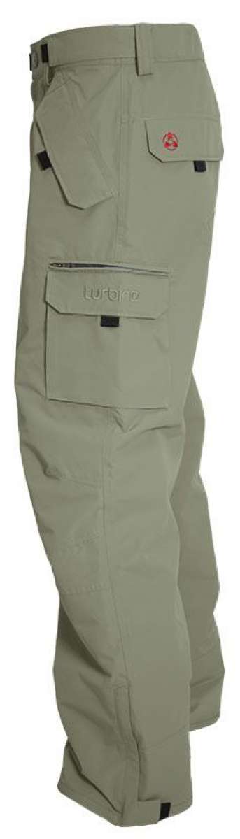Turbine FDGB Shell Pant 2022 - A pair of khaki-colored pants with a red logo on the upper left pocket.