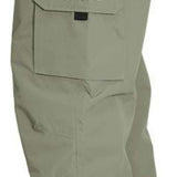 Turbine FDGB Shell Pant 2022 - A pair of khaki-colored pants with a red logo on the upper left pocket.